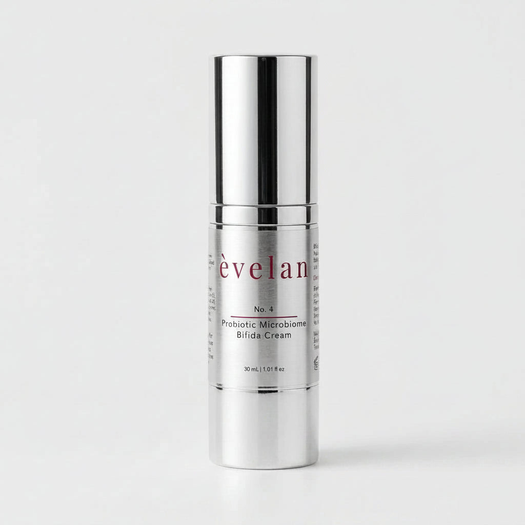 Silver skincare cream bottle with 'évelan' branding on a white background